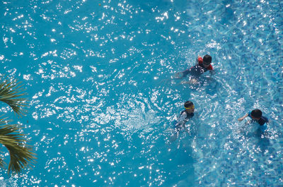 People swimming in water