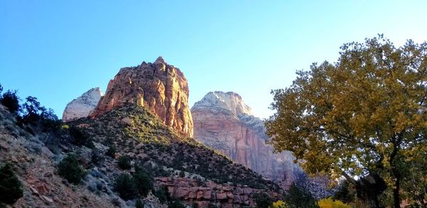 Low angle view of rock formations against sky