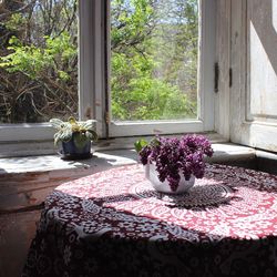 Close-up of flower vase on table at home