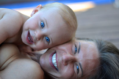 Portrait of cute baby boy with mother