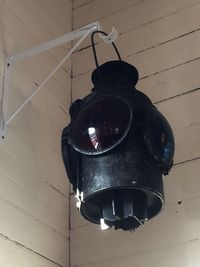 Low angle view of illuminated lantern hanging at home