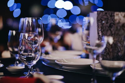 Close-up of wine glasses on table in restaurant