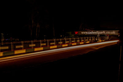 Light trails on street in city at night