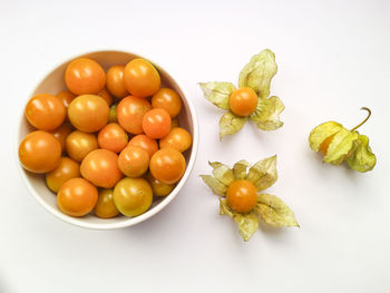 High angle view of oranges in bowl on table