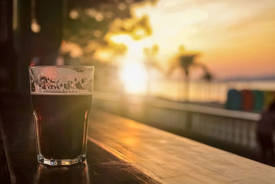 Close-up of beer glass on table