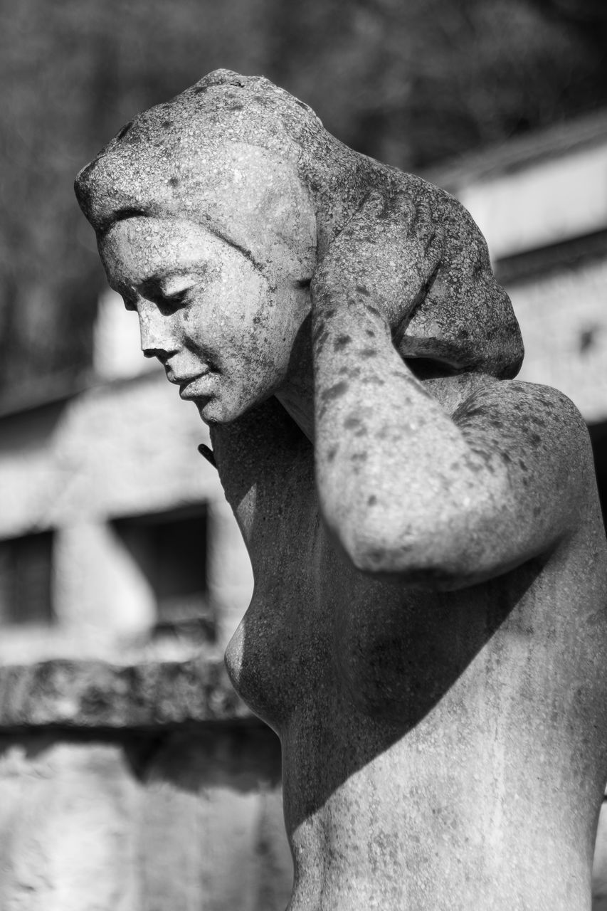 CLOSE-UP OF STATUE OF OLD FEMALE