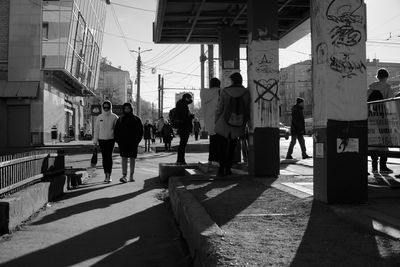 People walking on street in city