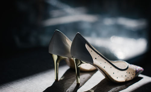 Close-up of shoes on table