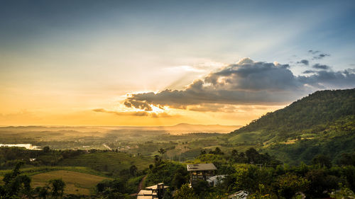 Scenic view of landscape against sky during sunset