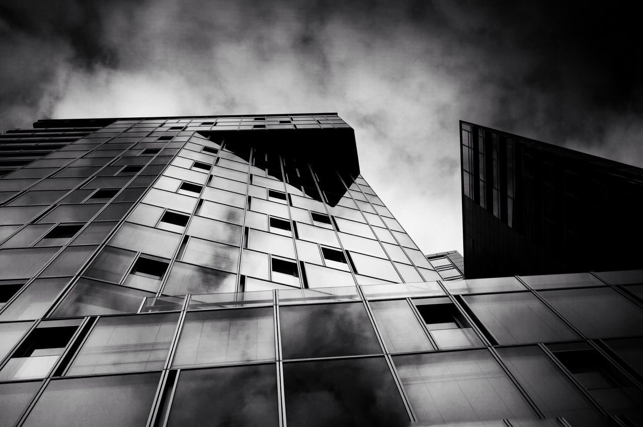 LOW ANGLE VIEW OF BUILDINGS AGAINST CLOUDY SKY