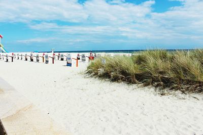 View of beach against cloudy sky