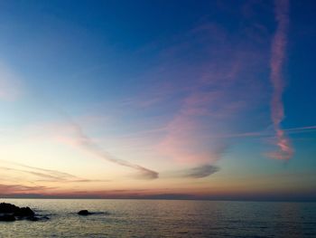 Scenic view of sea against sky at sunset