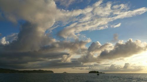 Scenic view of sea against cloudy sky