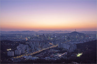 High angle view of city buildings during sunset