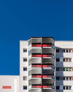 Low angle view of building against blue sky