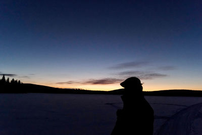Silhouette of man at night