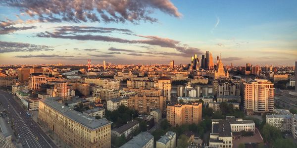 High angle view of city buildings during sunset