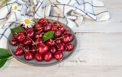 High angle view of strawberries in bowl on table