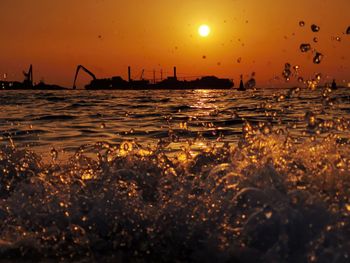 Sunset and splashing waves 