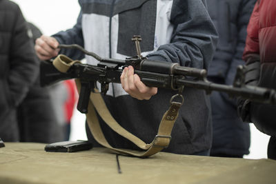 Children learn to shoot in russia. assembly of automatic weapons. lesson in military training. 