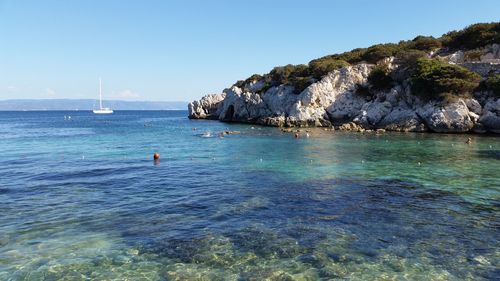 Scenic view of sea against blue sky