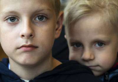Close-up portrait of boys at home