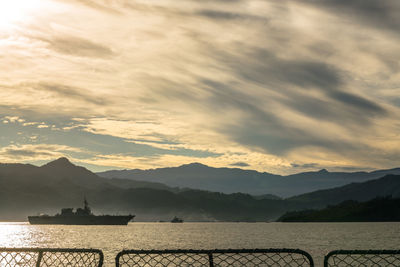 Scenic view of lake against sky during sunset