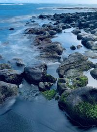 High angle view of rocks at sea shore