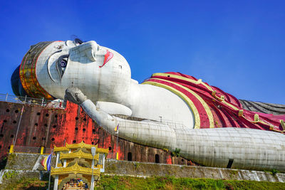 Low angle view of statue against building