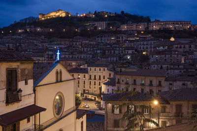 Illuminated buildings in city at night