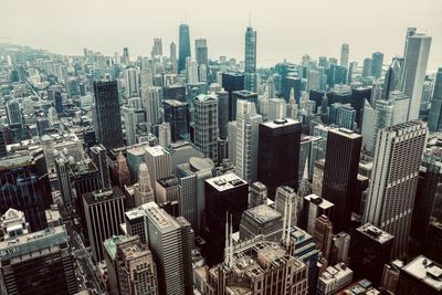 Aerial view of modern buildings in city against sky