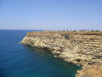 Scenic view of sea against clear blue sky