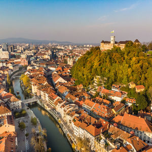 High angle view of river amidst buildings against sky