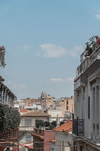 Buildings in city against sky