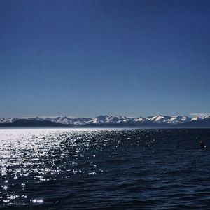 Scenic view of sea against clear blue sky