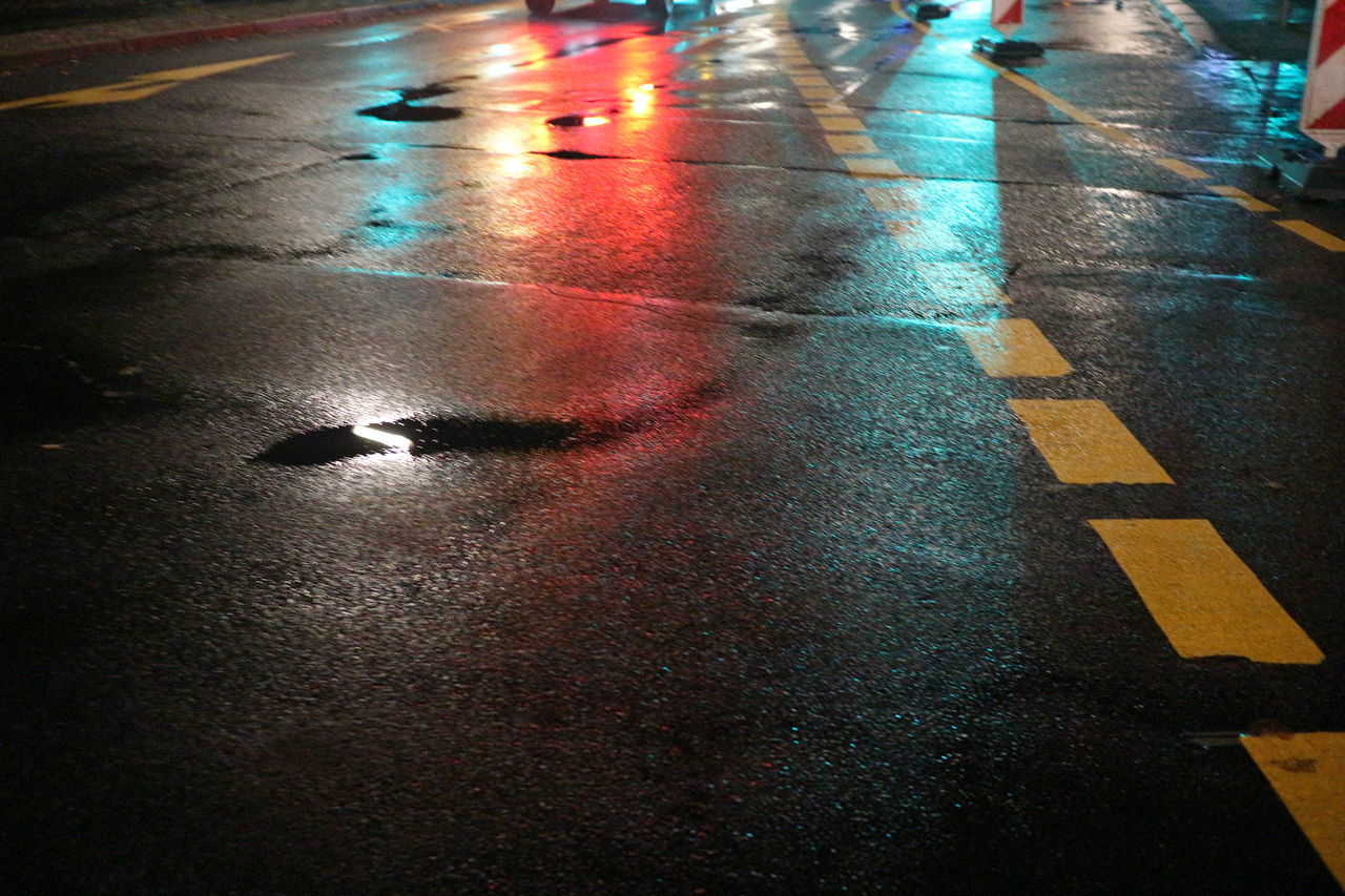 SURFACE LEVEL OF WET ROAD IN CITY