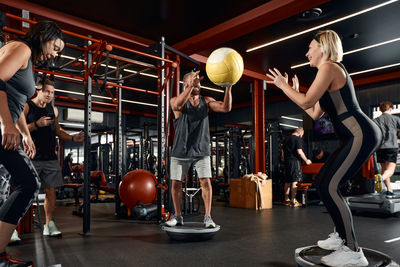 Athletes exercising in gym