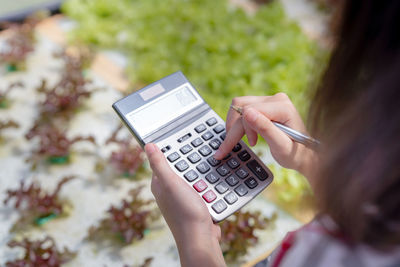 Close-up of woman using mobile phone