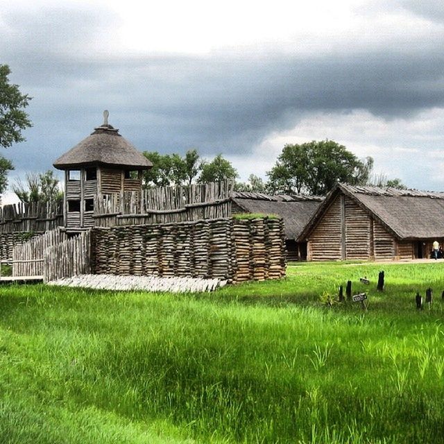 architecture, building exterior, built structure, grass, sky, cloud - sky, field, cloudy, green color, house, tree, cloud, grassy, overcast, growth, day, roof, outdoors, lawn, rural scene