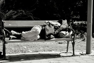 Two people relaxing on tree