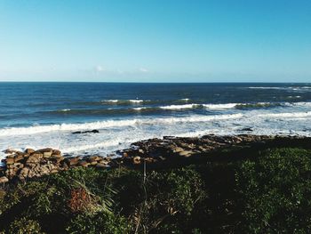 Scenic view of sea against clear sky