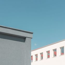 Low angle view of building against clear blue sky