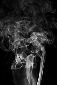 Close-up of smoke against black background 