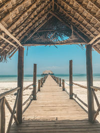 Pier over sea against sky