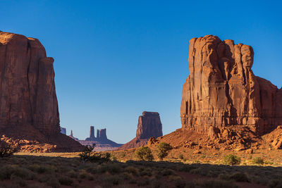 Rock formations on mountain against sky