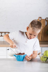 Boy preparing breakfast at home