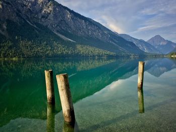 Scenic view of lake and mountains against sky