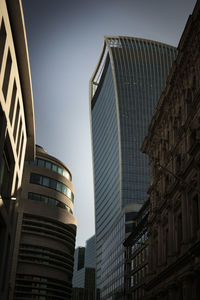 Low angle view of modern buildings against clear sky