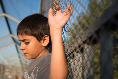 Child against fence on lockdown