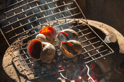 High angle view of meat on barbecue grill